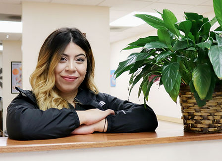 Marisela Torres at the front desk